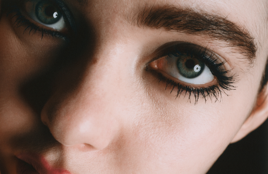 closeup of model`s eyes and dark eye makeup